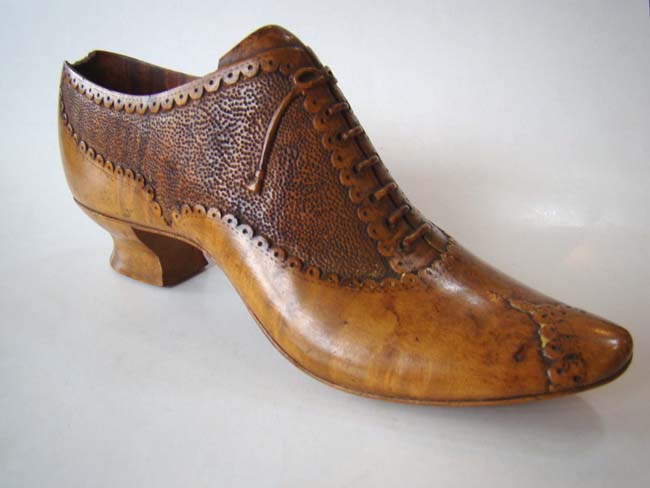 A charming late 19th century carved wooden ladies shoe circa 1890